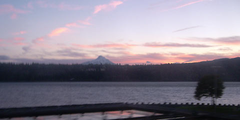 Pink and orange clouds at sunset with Mt. Hood in background