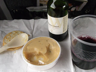 Wine, packaged cheese spread and crackers