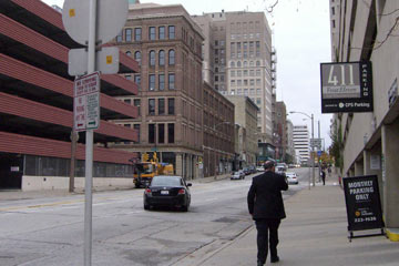 View up downtown street with few pedestrians