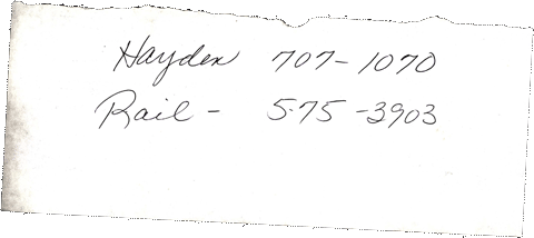 Phone numbers written on a scrap of paper
