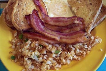 Plate with potatoes, eggs and lots of bacon