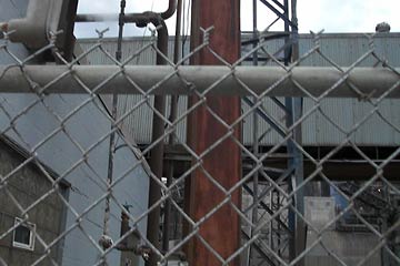 Pipes, girder, chain link fence