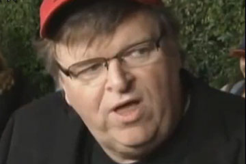 Close-up of Michael Moore being interviewed