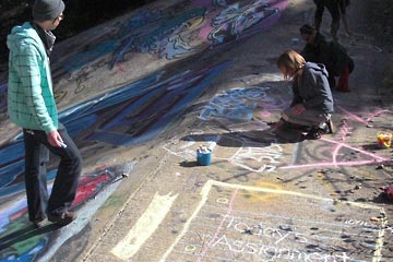Peter and others doing chalk graffiti