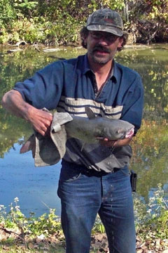 Man holding a big catfish