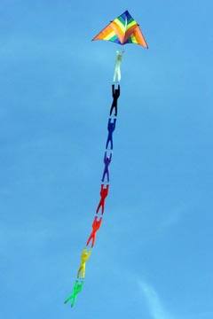 Kite with multi-color figures hanging on