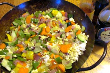 Vegetables and rice in wok