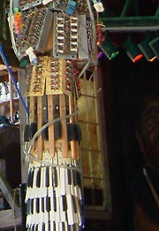 Keyboards and other instrument parts on a post at Mike's Barn