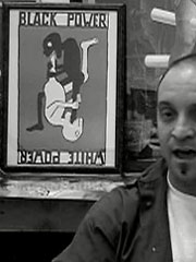 James Victore in his studio, Black/White Power poster in background